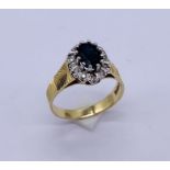 A diamond and sapphire ring set in 18ct gold, total weight 4.2g