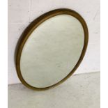 A vintage oval gilt framed mirror