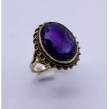 A 9ct gold ring set with an amethyst