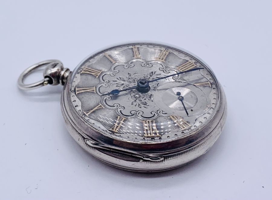 A hallmarked silver pocket watch with fusee movement. The chased silver dial with subsidiary