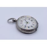 A 935 silver fob watch with ornate enamelled dial