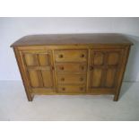 An Ercol Golden Dawn sideboard