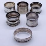 A collection of six hallmarked silver napkin rings