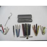 A collection of vintage pens and pencils etc.