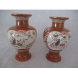 A pair of early 20th Century Japanese Kutani vases, hand painted with traditional scenes including