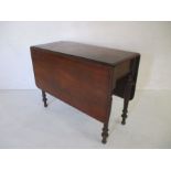 A Victorian mahogany dropleaf table