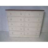 A painted pine chest of eight drawers - height 82cm, width 97cm, depth 29cm.