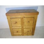 A pine chest of four large drawers
