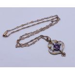 A 9ct rose gold Art Nouveau pendant set with an amethyst on matching chain