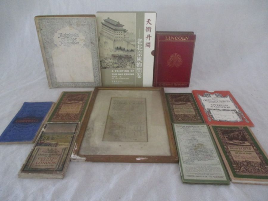 A collection of books maps etc. including Rubaiyat of Omar Khayyam, a framed 1925 Somerset v