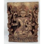 An Eastern carved wall hanging panel