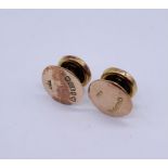 A pair of 9ct gold studs, total weight 1g