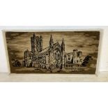 A large framed carpet from Axminster Carpets of Buckfast Abbey 144cm x 75cm