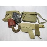 A WW2 gas mask in original bag, along with a WW2 ammo bag and holster with bayonet holder