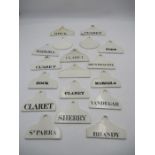 A collection of twenty one 19th century white glazed pottery wine bin labels including Hock,