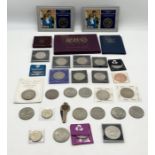 A collection of various commemorative crowns, coin sets etc.