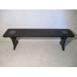 A gothic style wooden bench