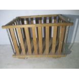 A slatted wooden industrial bobbin trolley