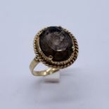 A 9ct gold ring set with a smoky topaz