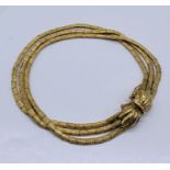 An 18ct gold three-strand bracelet, weight 23.3g