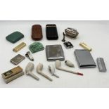 A collection of various smoking paraphernalia including lighters, pipes, cigar cases etc.