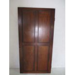 A Mahogany panelled door, with lock and key. 80cm x 2cm, height 158cm