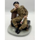 A Royal Doulton Classics figure group 'The Railway Sleeper', depicting a WWI black beret soldier