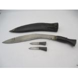 A Kukri knife in leather sheath with two secondary knives- sheath A/F