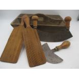 A rustic cutlery tray along with butter pats and herb cutters