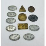 A collection of various Railway checks and tokens including Longmoor Military Railway, London