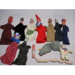 A vintage set of Punch & Judy puppets including Punch, Judy, Policeman, Devil, Clown, Dog, Ghost,