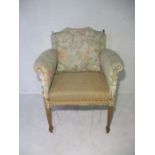 An Edwardian arm chair with a reclining ratcheted back, in need of restoration.