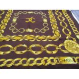 A vintage Chanel silk scarf, printed in depiction of gold belcher-link identity chains incorporating