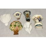 A collection of wall sconces including Honiton Pottery