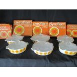 A collection of six retro 1970's Pyroflam/Pyrosil Orange casserole dishes (five boxed) by Corning,