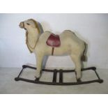 A 20th Century Rocking Camel with Carved Wooden Muzzle and Hooves, overall length 143cm