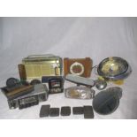 An assortment of vintage car parts including mirrors, petrol caps, lights, plus a boxed Churchill