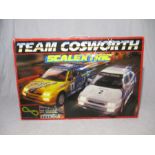 A vintage Scalextric Team Cosworth boxed set.