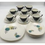 A quantity of Melaware, includes six cups with saucers plus side plates and one larger plate .
