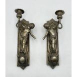 A pair of silvered brass cherub wall sconces