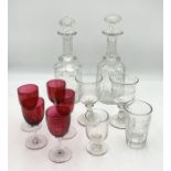 A small collection of mainly antique glass including two decanters and five matching cranberry