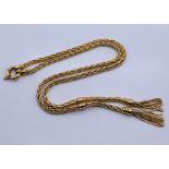 A 9ct gold necklace with two tassels, weight 17.1g