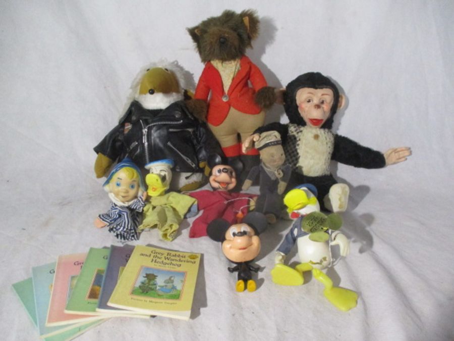 A collection of soft toys including a vintage Womble in Harley Davidson jacket, fox huntsman,