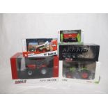 Two boxed die-cast tractors (1:32 scale) including a Claas 870 Axion and Universal Hobbies Case IH