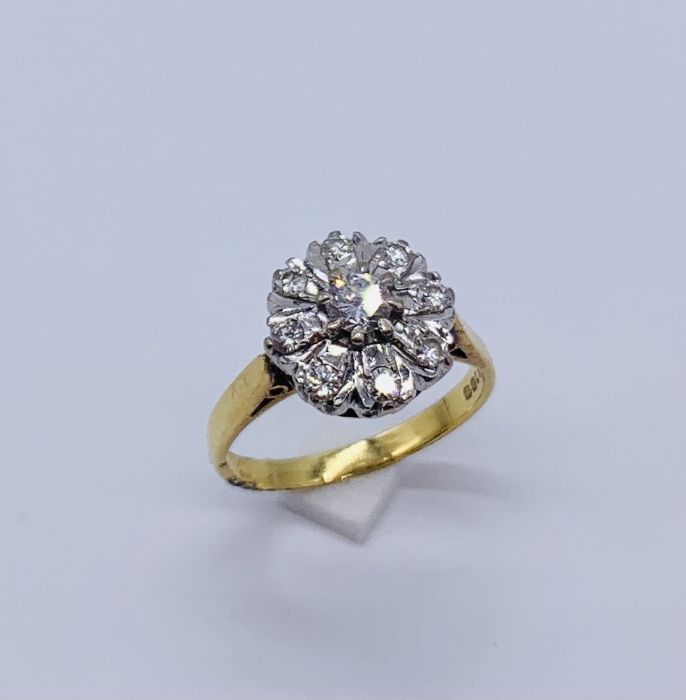 An 18ct gold diamond cluster ring