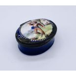 A Bilston style enamelled pill/patch pot depicting a boy playing badminton- A/F