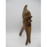 A novelty carved nutcracker in the form of a man