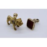 A gold plated Victorian fob with agate seal along with a gold coloured bulldog on 9ct gold clip