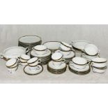 An Eschenbach part dinner service with gilt detail, to include 8 cups and saucer, 8 soup bowls,