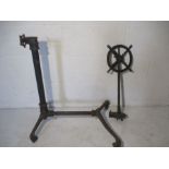 A Victorian cast iron stand on four wheels.